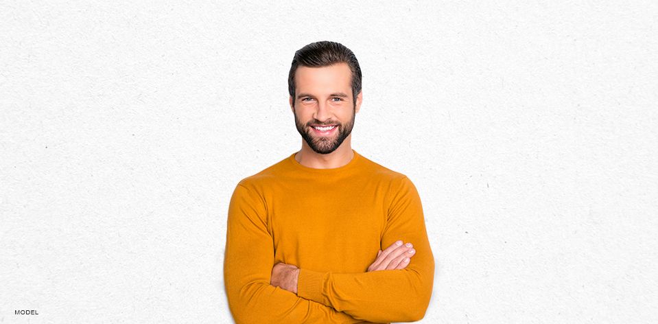 Handsome Middle Aged Smiling Man in Yellow Sweater
