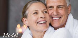 Mature Couple Smiling and Touching Cheeks Together